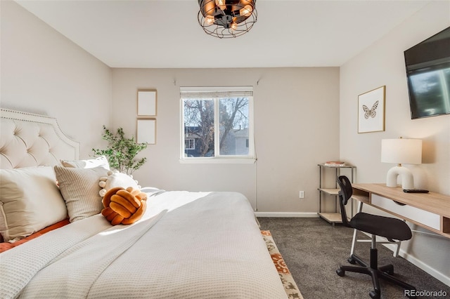 bedroom featuring dark carpet