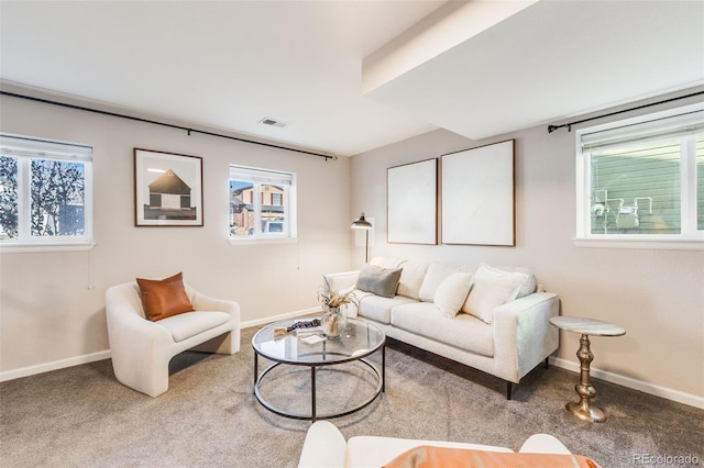 living room with plenty of natural light and carpet flooring