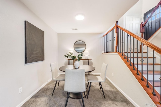 dining space with carpet floors