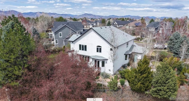 drone / aerial view featuring a mountain view and a residential view