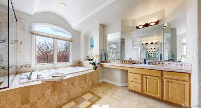 full bath featuring a tile shower, a garden tub, vanity, tile patterned flooring, and lofted ceiling