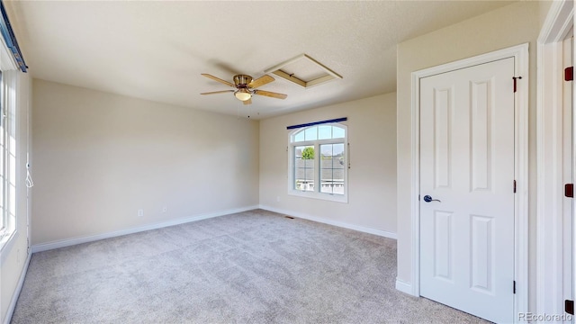 unfurnished bedroom with baseboards, ceiling fan, and carpet
