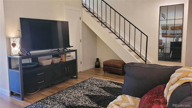 442 S Carr St, Lakewood, CO 80226 - living room featuring wood finished floors and stairs