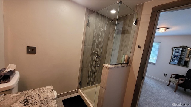 442 S Carr St, Lakewood, CO 80226 - bathroom featuring toilet and a shower stall