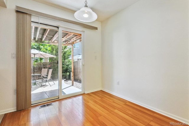 entryway with hardwood / wood-style floors