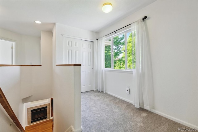 interior space with a tiled fireplace