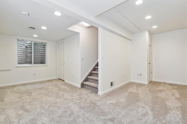 basement with light colored carpet