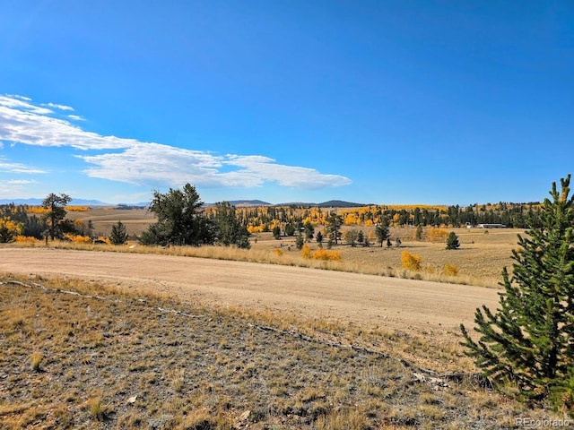 view of mountain feature with a rural view