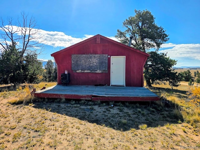 view of outbuilding featuring a lawn