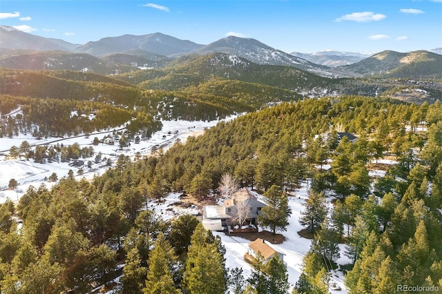 aerial view featuring a mountain view and a view of trees