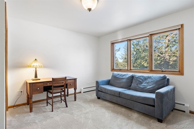 office area with baseboards, a baseboard radiator, and light colored carpet