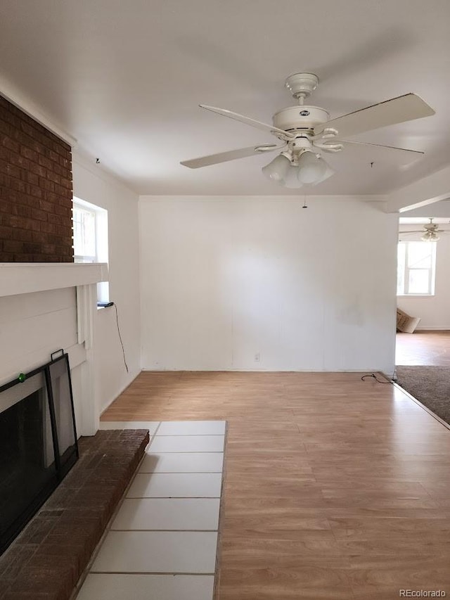 938 Salem St, Aurora, CO 80011 - unfurnished living room featuring a ceiling fan and light wood finished floors