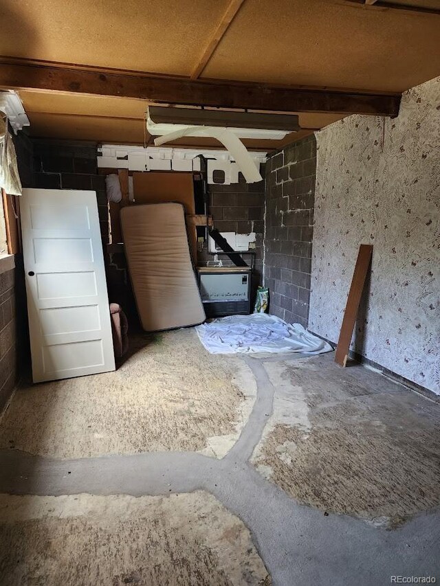 938 Salem St, Aurora, CO 80011 - miscellaneous room with concrete block wall
