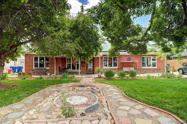 938 Salem St, Aurora, CO 80011 - obstructed view of property with brick siding