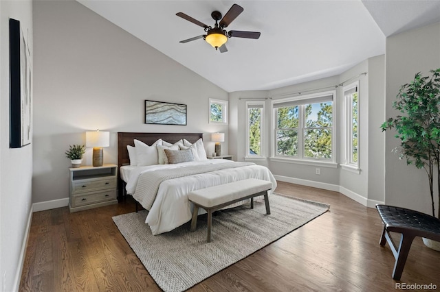 bedroom featuring lofted ceiling, ceiling fan, dark wood-type flooring, and baseboards