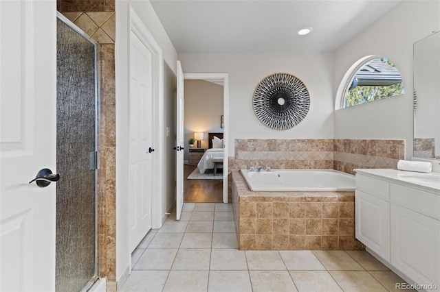 ensuite bathroom with a stall shower, ensuite bath, a bath, and tile patterned floors