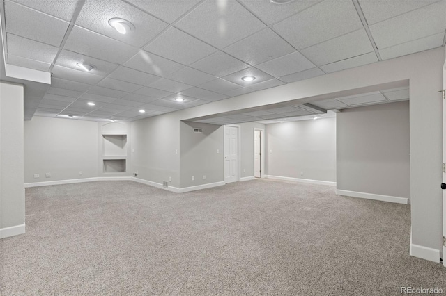 finished below grade area with carpet floors, recessed lighting, and baseboards