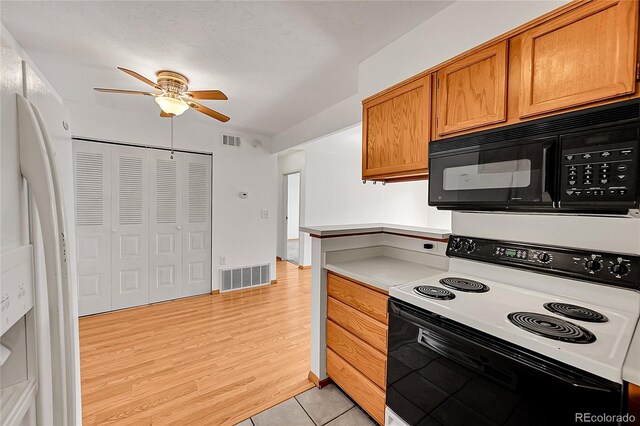 420 Zang St Unit 108, Lakewood, CO 80228 - kitchen with a ceiling fan, black microwave, range with electric cooktop, and visible vents