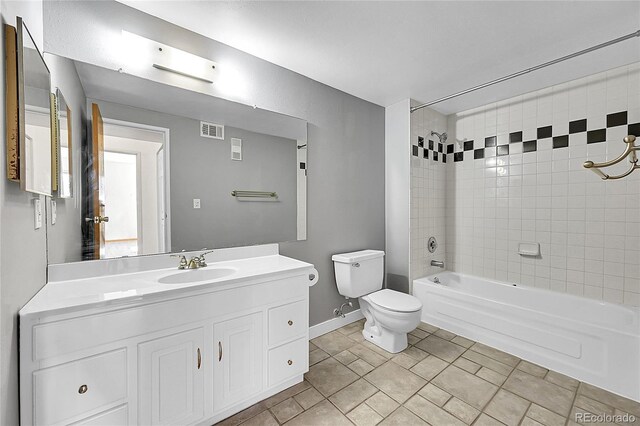 420 Zang St Unit 108, Lakewood, CO 80228 - full bath with toilet, vanity, shower / bathing tub combination, baseboards, and visible vents
