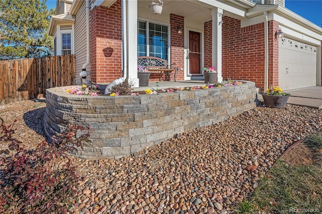 view of exterior entry with a garage