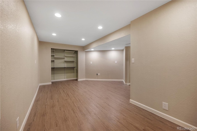 empty room with hardwood / wood-style floors