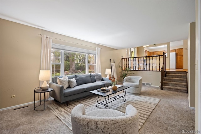 5808 E Hinsdale Pl, Centennial, CO 80112 - living room with carpet, baseboards, and stairs