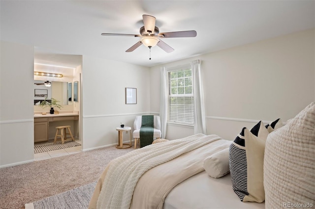 5808 E Hinsdale Pl, Centennial, CO 80112 - bedroom with light carpet, baseboards, ceiling fan, and ensuite bath