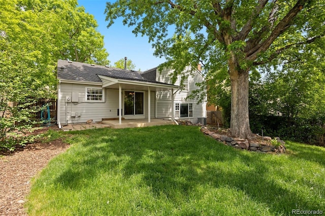 5808 E Hinsdale Pl, Centennial, CO 80112 - rear view of house featuring a patio, roof with shingles, and a chimney