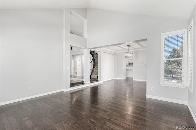 unfurnished living room featuring dark wood-type flooring and lofted ceiling