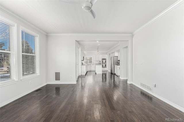 unfurnished living room with ceiling fan, ornamental molding, and dark hardwood / wood-style flooring