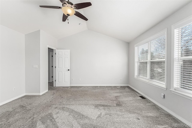 unfurnished room featuring vaulted ceiling, ceiling fan, and carpet flooring