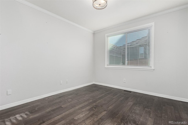 unfurnished room featuring ornamental molding and dark hardwood / wood-style floors