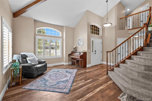 603 E 2nd Ave, Castle Rock, CO 80108 - foyer featuring wood finished floors, stairs, and high vaulted ceiling