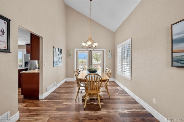 603 E 2nd Ave, Castle Rock, CO 80108 - dining space featuring dark wood-style flooring, a chandelier, and high vaulted ceiling