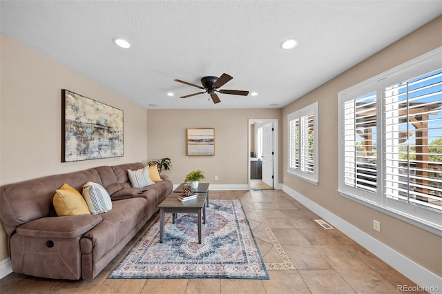 603 E 2nd Ave, Castle Rock, CO 80108 - living room with ceiling fan, recessed lighting, and light tile patterned floors
