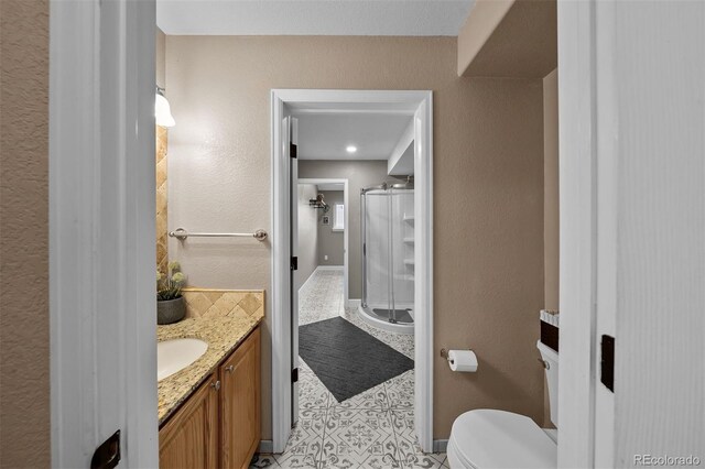 603 E 2nd Ave, Castle Rock, CO 80108 - bathroom featuring vanity, tile patterned floors, and a walk in shower