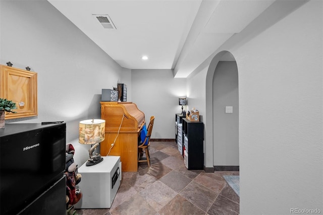 603 E 2nd Ave, Castle Rock, CO 80108 - office space featuring arched walkways, dark stone finish flooring, and recessed lighting