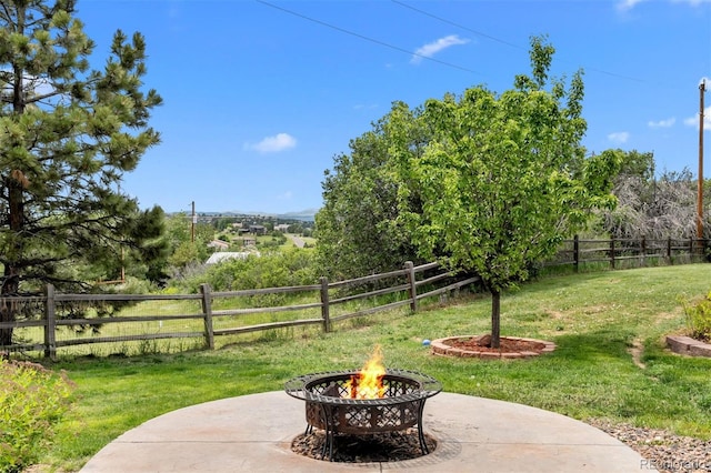 603 E 2nd Ave, Castle Rock, CO 80108 - fenced backyard featuring an outdoor fire pit and a patio
