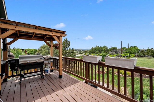 603 E 2nd Ave, Castle Rock, CO 80108 - wooden terrace featuring a grill and a lawn