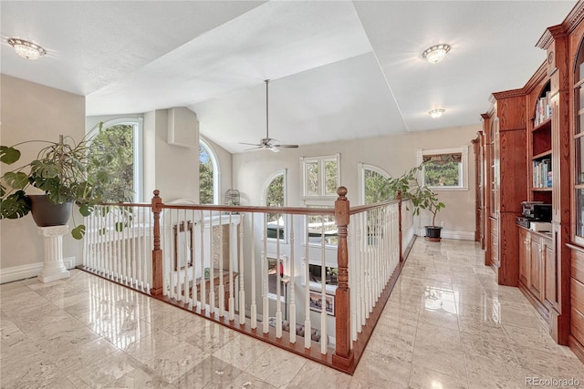 hall with vaulted ceiling