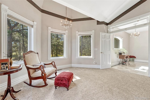 sitting room featuring high vaulted ceiling, an inviting chandelier, and carpet