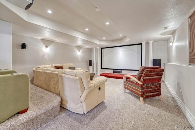 carpeted home theater featuring ornate columns