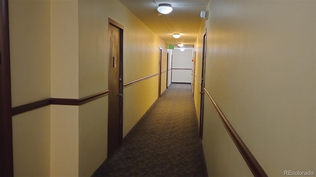 hallway featuring carpet flooring