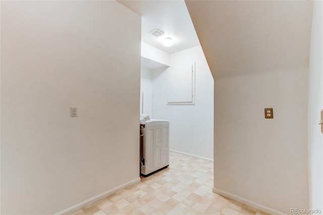 washroom with washer / clothes dryer, light floors, visible vents, and baseboards