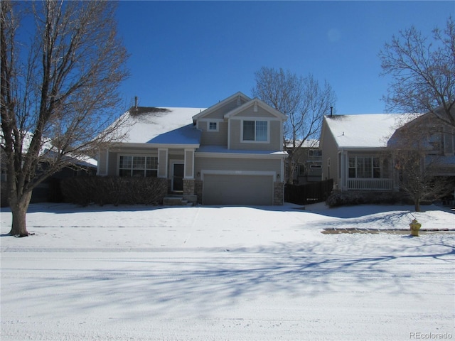 view of front of property with stone siding and an attached garage