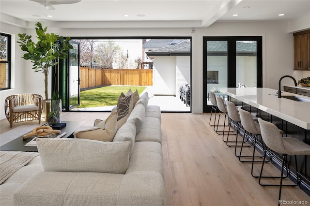 1195 S Milwaukee St, Denver, CO 80210 - living area with light wood-type flooring and recessed lighting