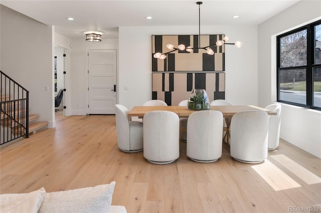 1195 S Milwaukee St, Denver, CO 80210 - dining room featuring light wood-type flooring, a chandelier, stairs, recessed lighting, and baseboards
