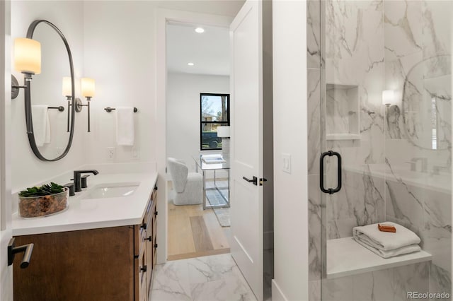 1195 S Milwaukee St, Denver, CO 80210 - full bathroom featuring marble finish floors, vanity, a marble finish shower, recessed lighting, and baseboards