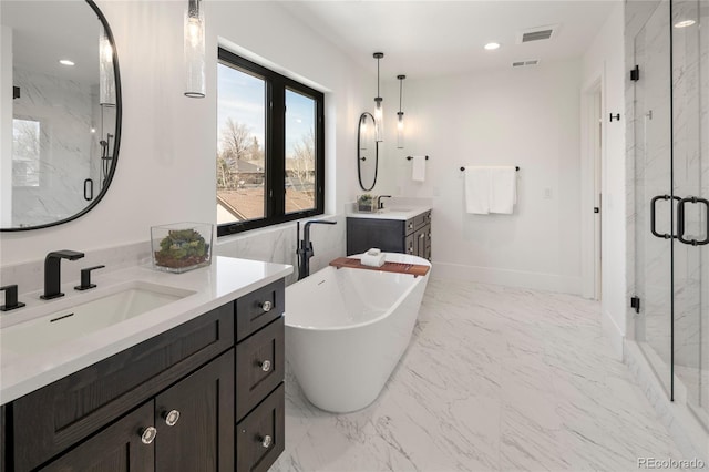 1195 S Milwaukee St, Denver, CO 80210 - full bathroom featuring a marble finish shower, a freestanding bath, two vanities, marble finish floors, and recessed lighting