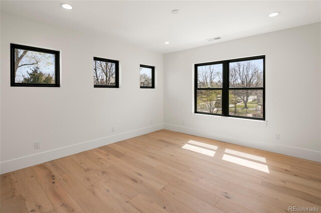 1195 S Milwaukee St, Denver, CO 80210 - empty room featuring baseboards, recessed lighting, and light wood-type flooring